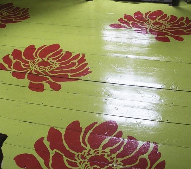 oversized-burgundy-flower-stencils-on-green-floor.jpg