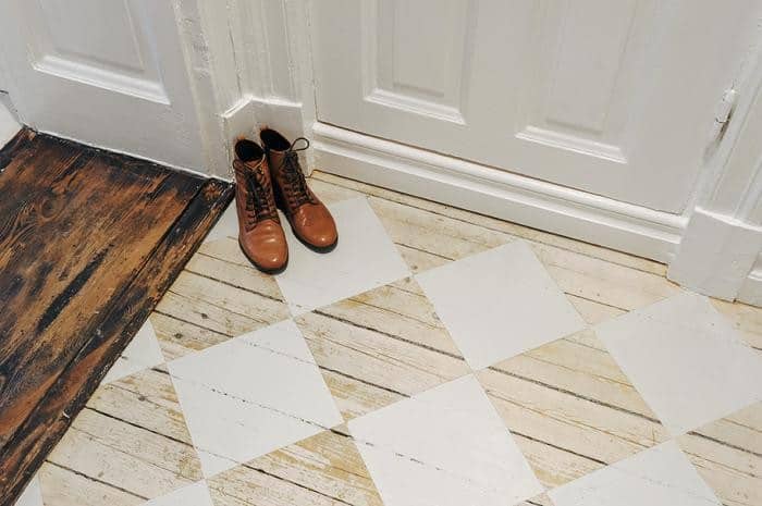 stenciled-checkerboard-pattern-foyer-rustic-wood-floors.jpg